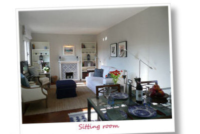 A large bright sitting room with dining area, satellite TV, DVD, music system and sofa bed